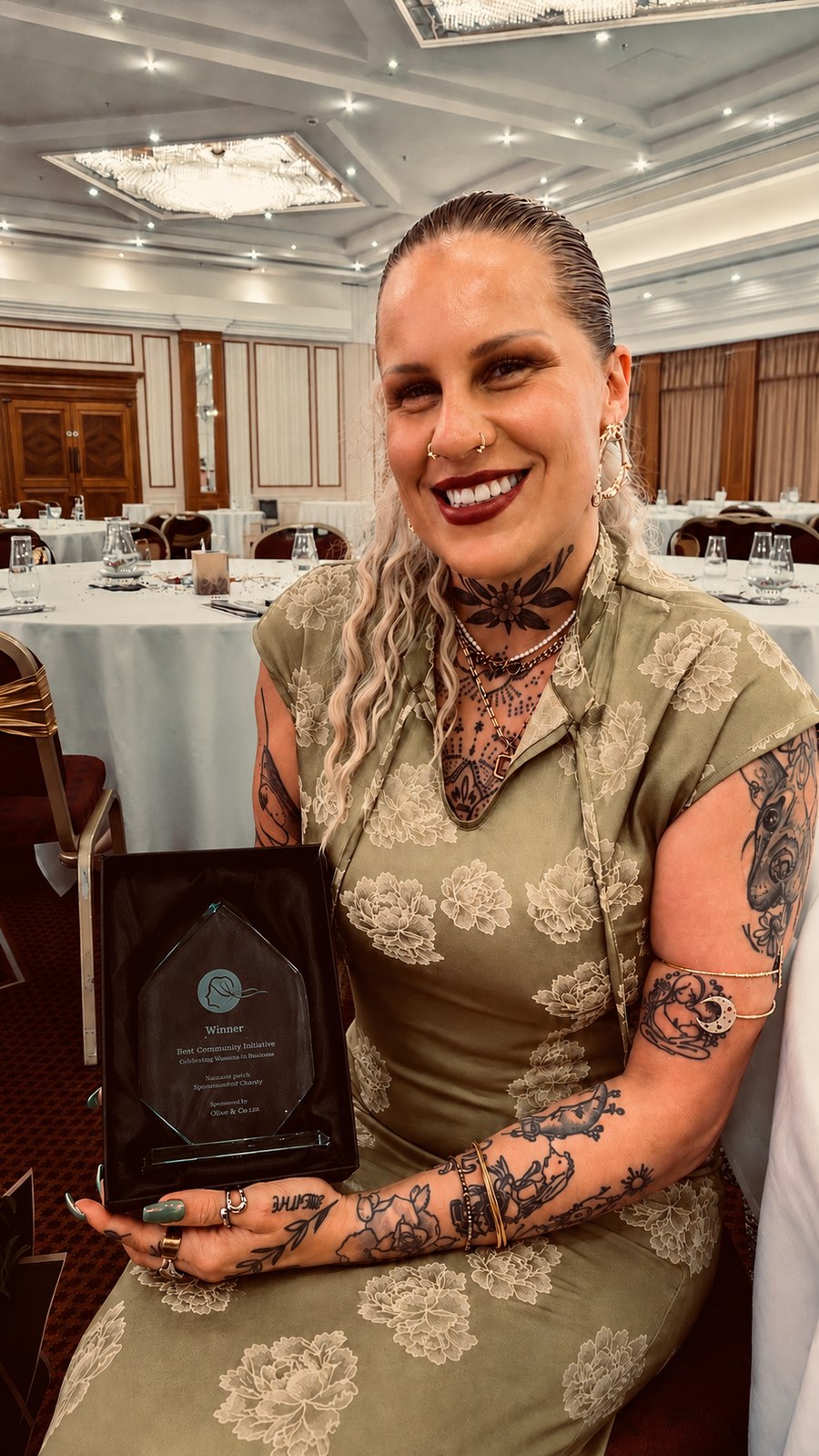 Soph holding her Best Community Initiative award